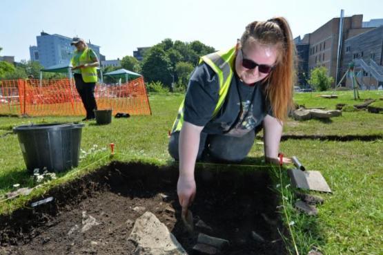 Archaeology student Alice Ward on a 'dig' on campus