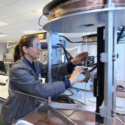 Dr Paula Palade, from Jaguar Land Rover, working on a machine