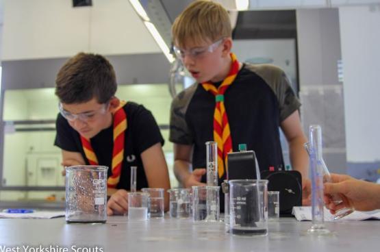 West Yorkshire Scouts Gabriel Freeman (left) and George Wilkinson, taking part in an experiment in a laboratory at the University of Bradford