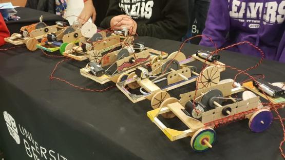 Cars made of cardboard, elastic bands and glue