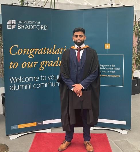 Zeeshan Hussain at graduation in 2022