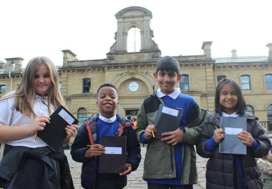 Pupils from Saltaire Primary show off their drawings of Saltaire