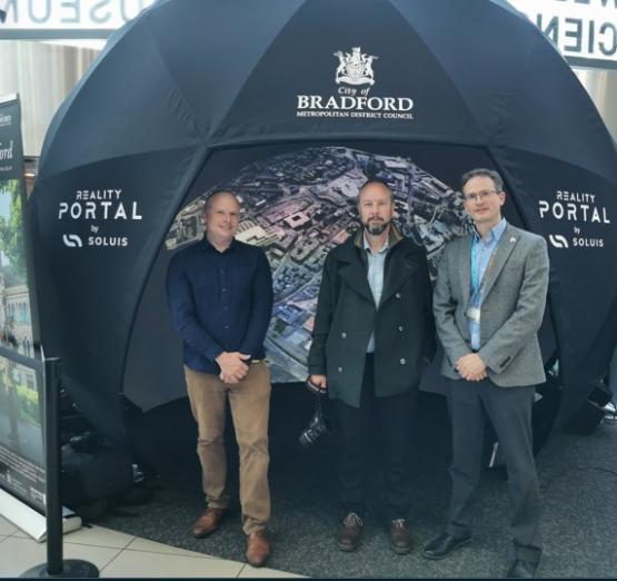 (left to right) Tom Sparrow, Senior Scientist at the University of Bradford,  Adrian Walker, Transformational Services Manager at Bradford Metropolitan District Council and Professor Wilson showing Virtual Bradford in a 