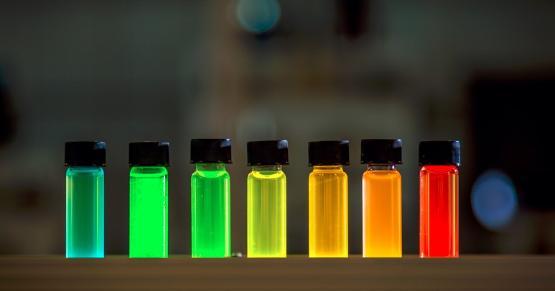 Vials of liquid coloured by quantum dots