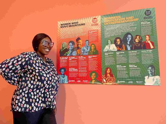 Student stood up in front of Black History Month posters