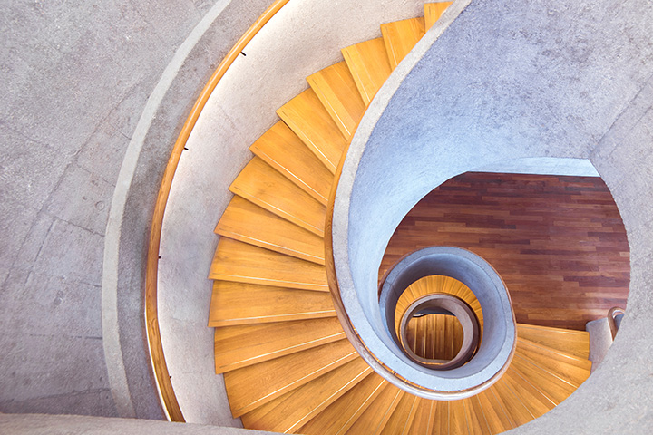 Birds eye view of a swirling staircase.