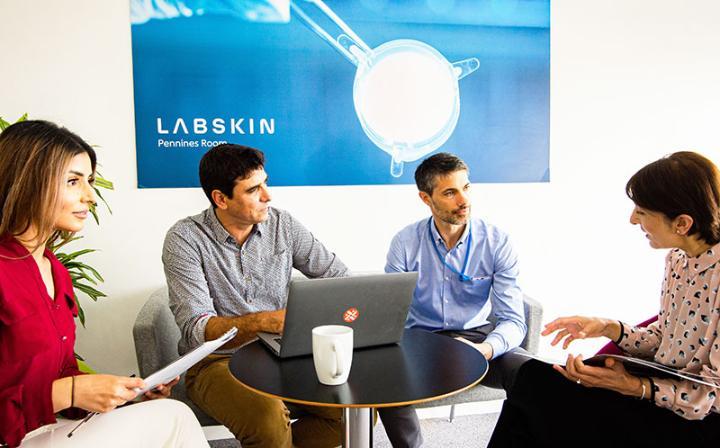 Omera Bi, David Caballero, Jacobo Elies, and Sobia Kauser at Labskin discussing their project