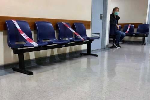 A waiting room with chairs taped over to ensure seating 2metres apart