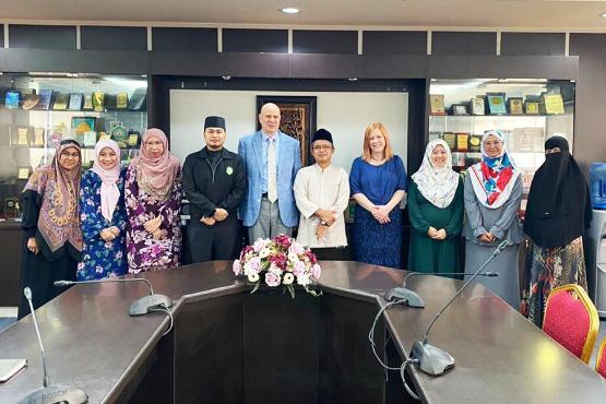 Prof Peter Mitchell and Alison Hedley from the University of Bradford with staff from UNISSA in Brunei
