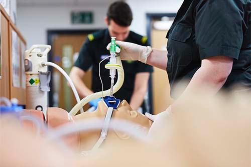Paramedic students in training performing resuscitation 