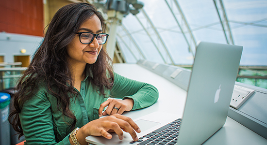 University of Bradford Student Zareen Khan studying on a laptop