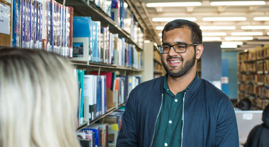 University of Bradford student Farooq Ashad in the library
