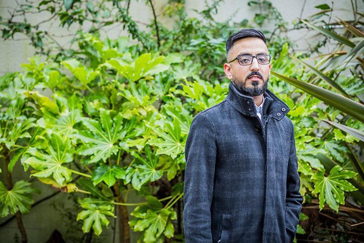 MSc Logistics, Data Analytics and Supply Chain Management graduate Mohammed Abaid in front of plants in Bright Building