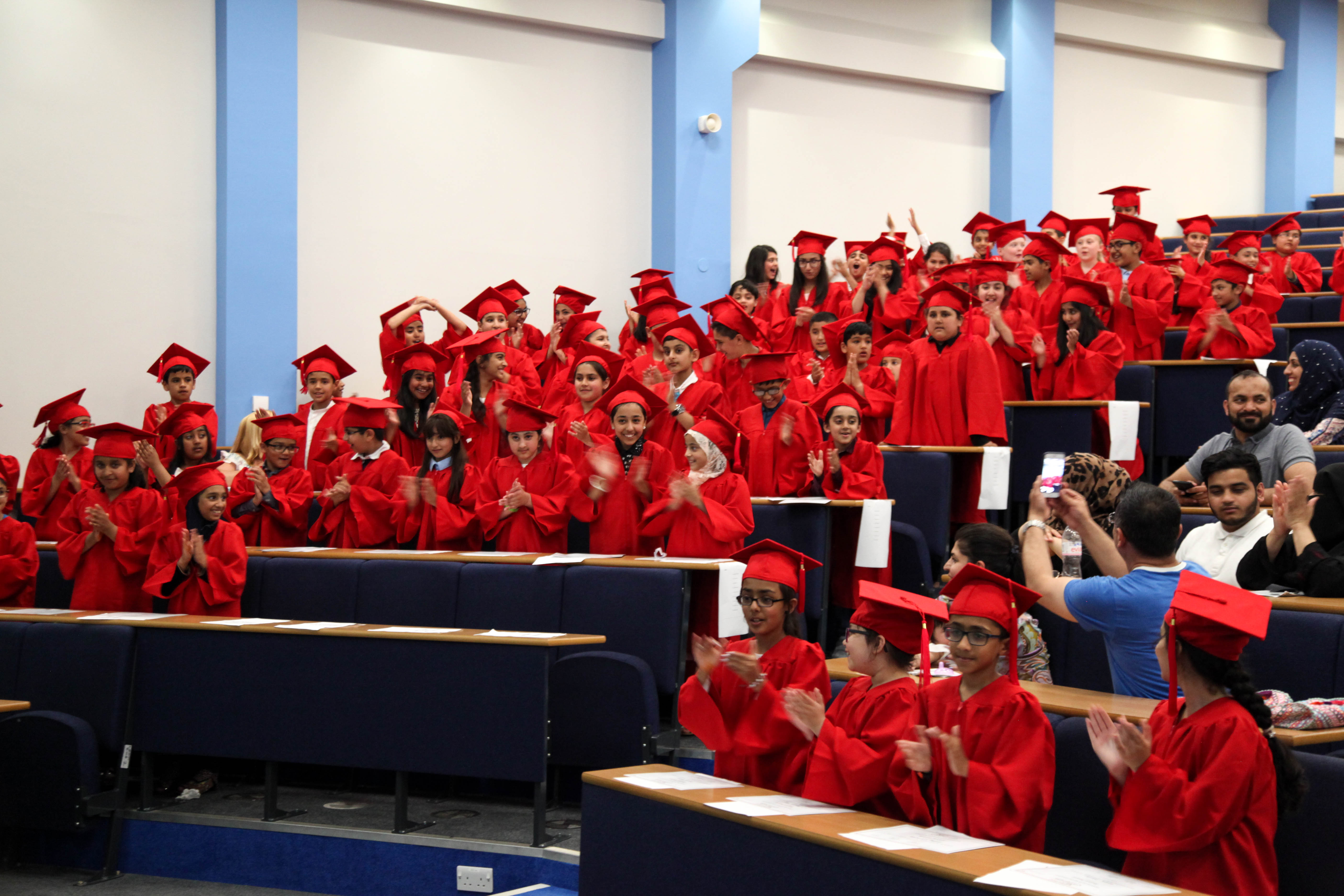 Students sat in a lecture theatre at the Children's University Programme graduation ceremony.