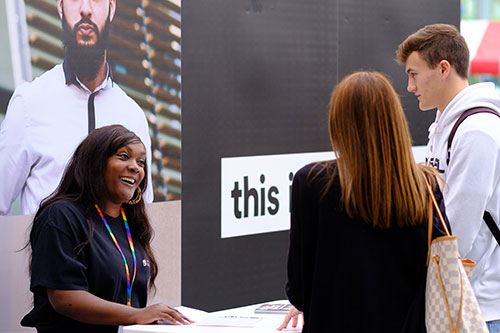 A student ambassador talking to prospective students at a University of Bradford Open Day