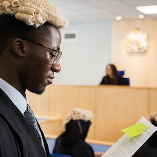 Law students in a courtroom mooting session 
