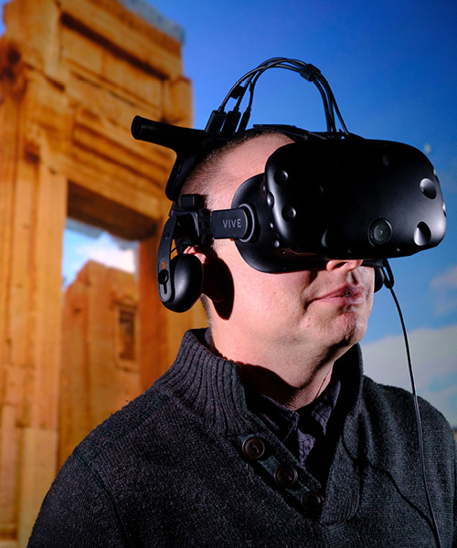 Person wearing virtual reality headset.