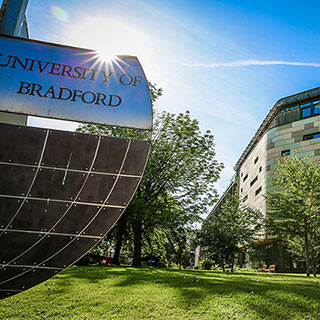The University of Bradford sign and the Horton Building on a sunny day.