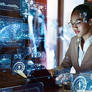 A stock image of a female at a computer.